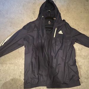 Adidas rain jacket in great condition, size large navy blue with white